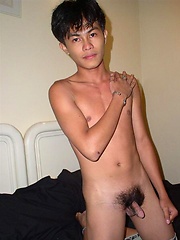 Smiley oriental boy shows his naked body