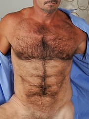 Tim drops his pants and starts to grope his growing cock through his boxers